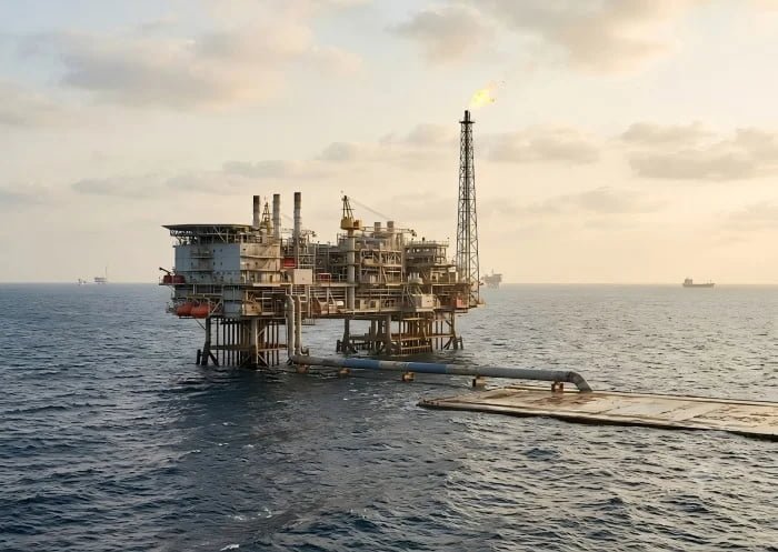 Technician applying composite wrap on offshore pipeline